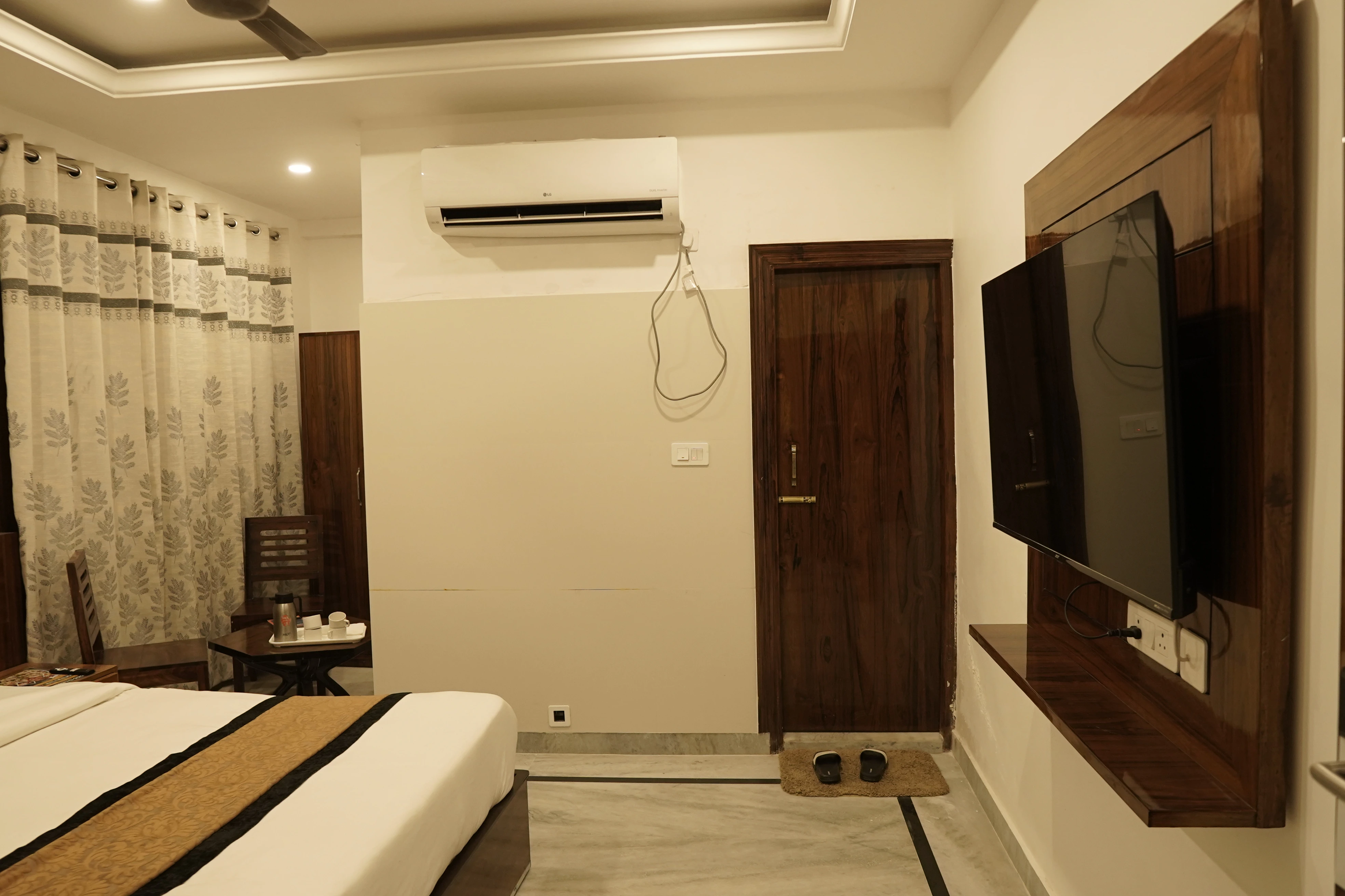 Premium Room at Hotel The Black Gold with 50-inch 4K Smart TV and serene interiors